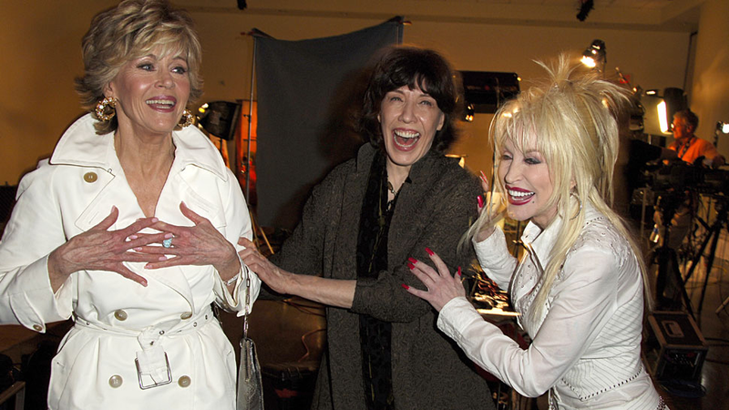 Illustration for article titled Dolly Parton's Boobs and Arms Are Covered in Secret Tattoos